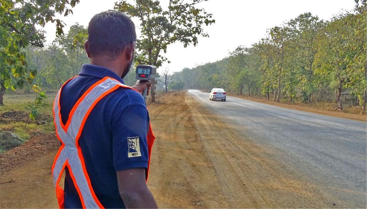 Corridor Connectivity: WCT team member collecting traffic speed data with a radar gun.
