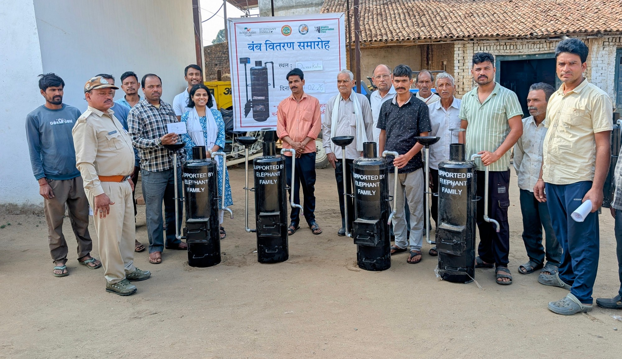 WCT - TIGERS, FORESTS, & COMMUNITIES - Water heater being distributed to beneficiaries by village representatives, teams of Pench Tiger Reserve and WCT at Darasi Kalan, a buffer village in Pench Tiger Reserve, Madhya Pradesh.