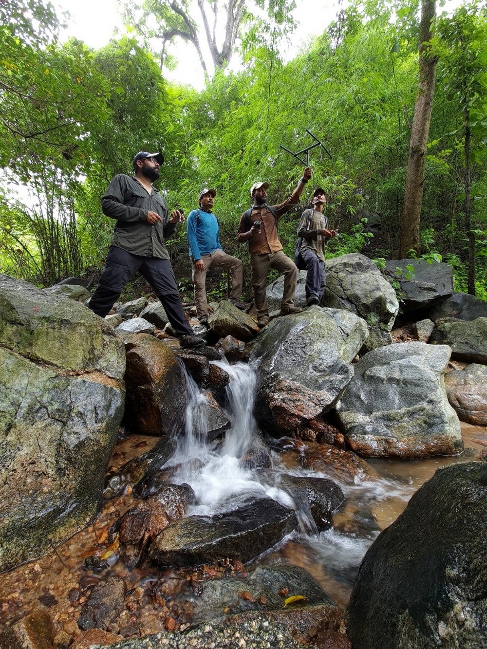 Man’s Best Friend: Sniffer Dogs Aid in Indian Pangolin Conservation - A tale of human-canine collaboration to save India’s elusive mammal. WCT’s field researchers using a receiver to check for radio signals transmitted by active radio tags on rehabilitated pangolins in Satpura Tiger Reserve. ©WCT
